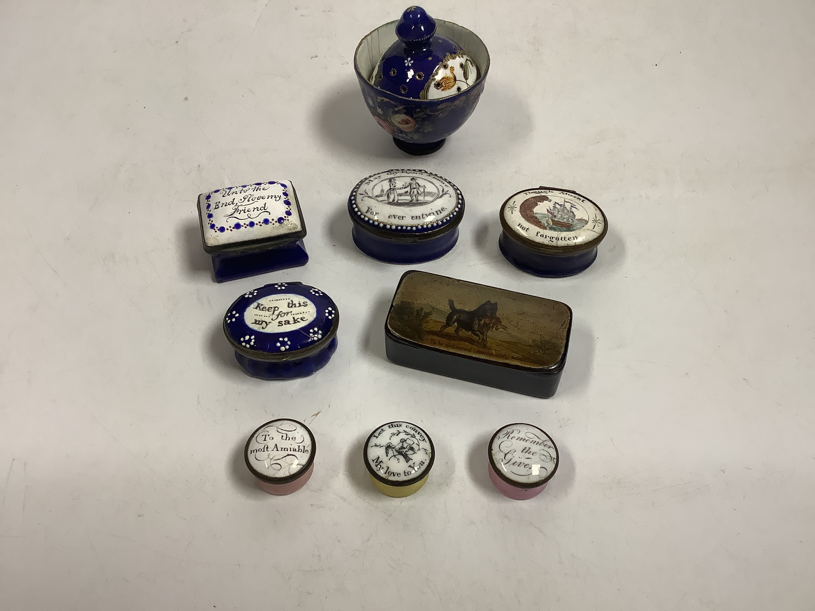 Two South Staffordshire enamel sweetheart patch boxes and two similar snuff boxes, three South Staffordshire enamel pill boxes, all late 18th/early 19th century, South Staffordshire enamel cup and associated cover and a